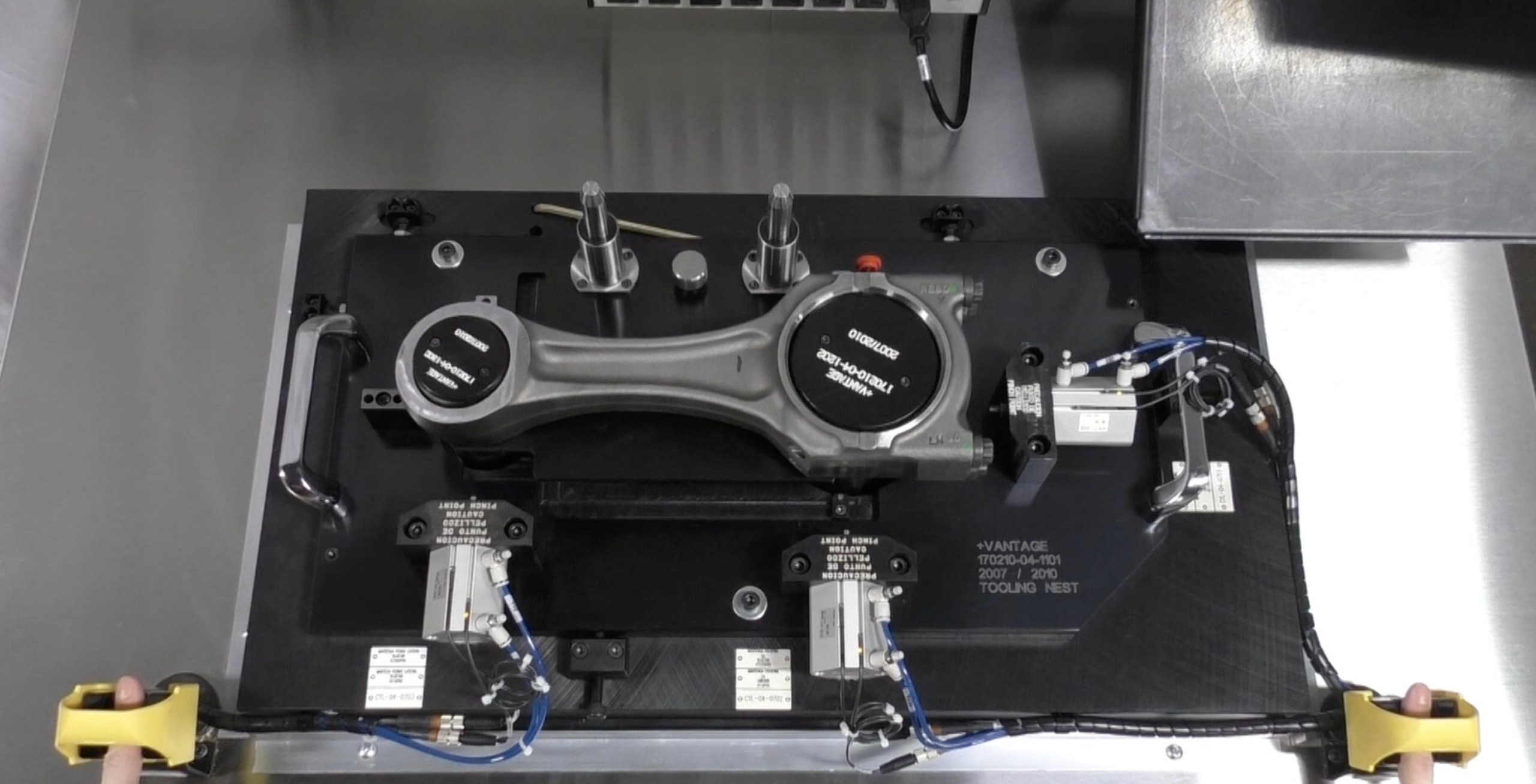 Technician inspecting a diesel engine connecting rod for wear and reconditioning at Motor Service Group in Miami