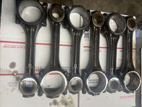 Technician inspecting worn connecting rod condition to prevent repeat diesel engine failure at Motor Service Group