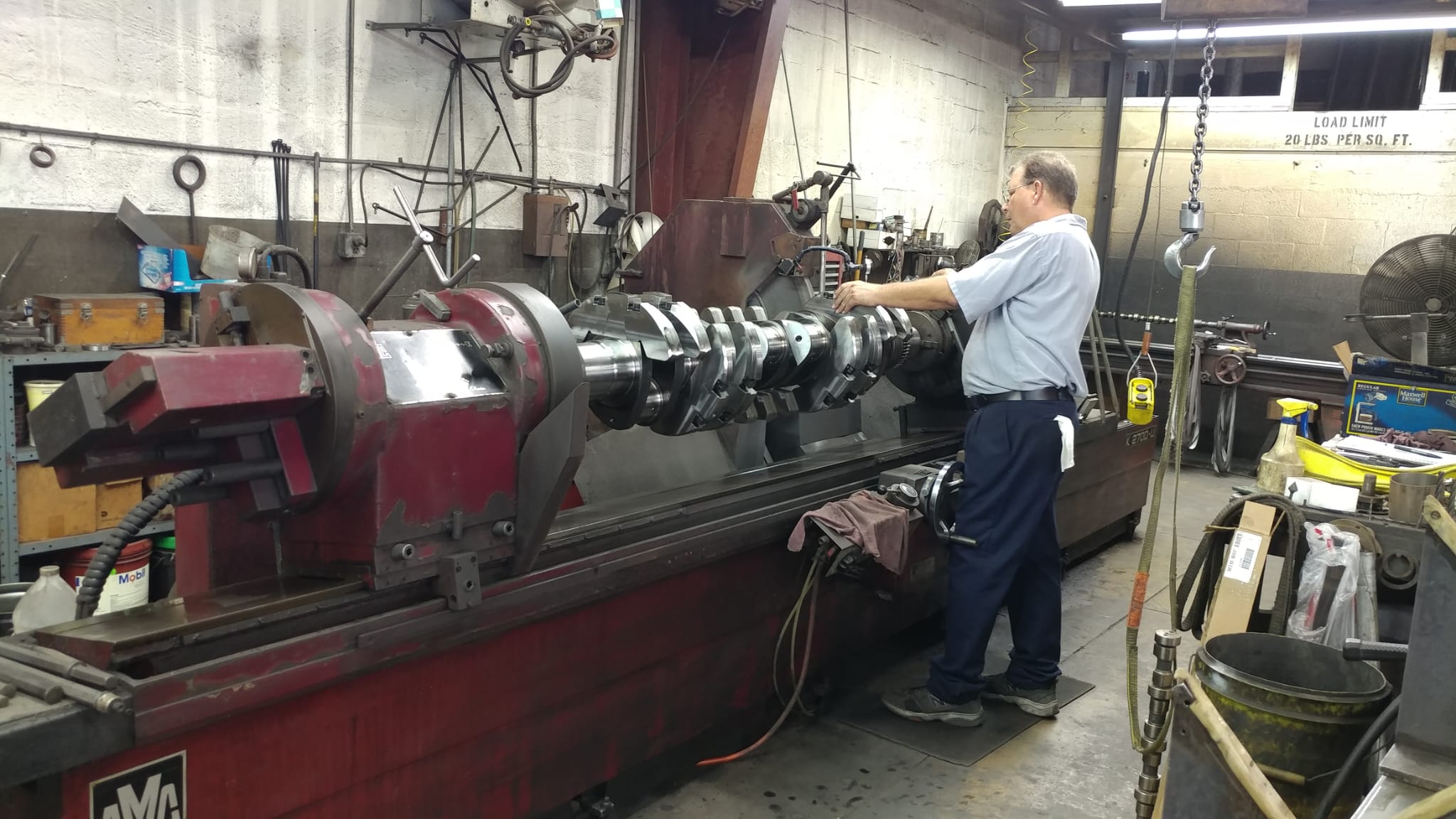 Diesel engine component being inspected at a Miami machine shop for precision repair support