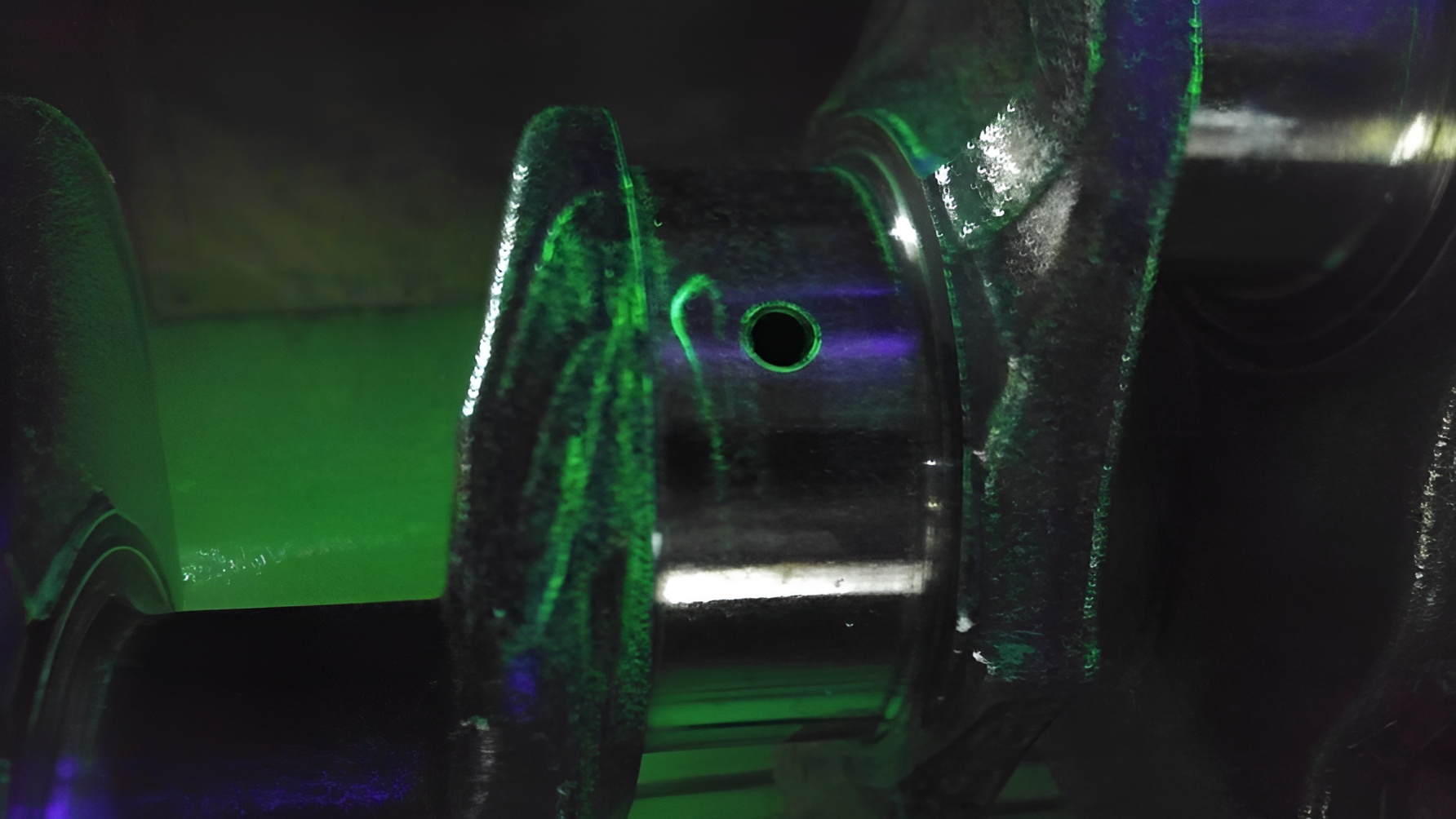 Diesel motor specialist inspecting heavy-duty engine components at a precision machine shop in Miami