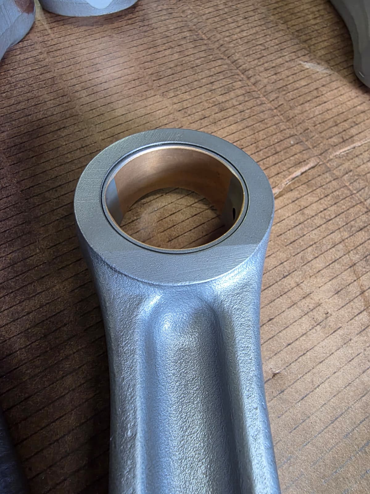 Diesel connecting rod bushing being inspected and measured at Motor Service Group machine shop in Miami South Florida